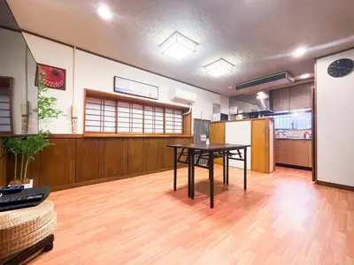 a large room with a table and a kitchen at 7\u6642IN19\u6642OUT # \u6c60\u888b\u738b\u5b50\u8d64\u7fbd\u99c5\u7121\u6599\u9001\u8fce # \u4e0a\u91ce\u99c514\u5206 # \u4e00\u68df\u8cb8\u3057 # 2LDK2LDK # \u6700\u592724\u4eba # 7 00 IN19 00 OUT # Free pick-up at Ikebukuro, Oji, and Akabane Stations # 14 min to Ueno # Whole house rental # 2LDK2LDK # Max 24 in Tokyo
