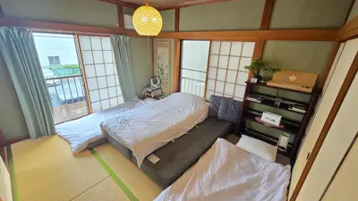 a small bedroom with a bed and a window at AsahiStay -Koiwa, Free parking O, Whole Family House, Japanese garden taste in Tokyo