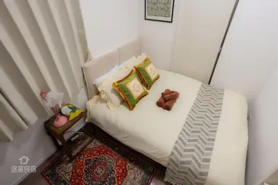 a small bed with pillows and a teddy bear on it at QiQi House serenity - Vacation STAY 43379v in Tokyo