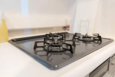 a stove top with four burners on a kitchen counter at QiQi House serenity - Vacation STAY 43379v in Tokyo