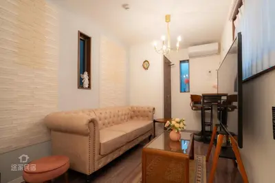 a living room with a couch and a table at QiQi House serenity - Vacation STAY 43379v in Tokyo