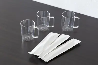 four empty glasses and napkins on a table at SLEEPLAB THE STAY Casual \u65b0\u5bbf in Tokyo