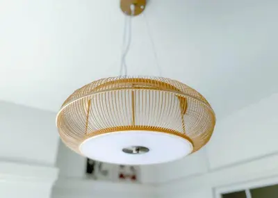 a rattan light fixture hanging from a ceiling at The Bonsai Otsuka 202, Fresh Parkside Private Apartment in Central Tokyo in Tokyo