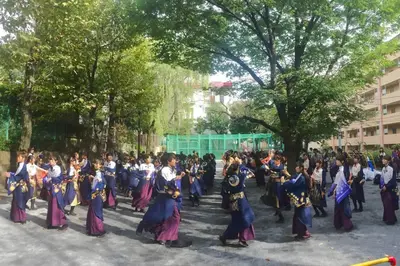 a group of people dancing in the street at The Bonsai Otsuka 202, Fresh Parkside Private Apartment in Central Tokyo in Tokyo