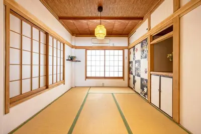 an empty hallway with a large window in a room at Eden House Skytree & Skygarden in Tokyo