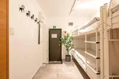 a hallway of a hospital room with bunk beds at Eden House Skytree & Skygarden in Tokyo