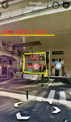 an empty parking garage with aoked road sign in it at Fuufu House Tokyo Ikebukuro in Tokyo