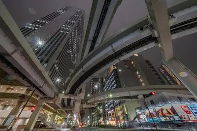 a view of a city at night with tall buildings at Fuufu House Tokyo Ikebukuro in Tokyo