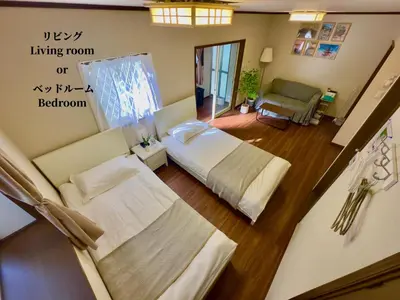 a bedroom with two beds and a living room or bedroom at 7\u6642IN19\u6642OUT # \u897f\u6b66\u65b0\u5bbf\u99c5\u96fb\u8eca11\u5206 # \u30c6\u30e9\u30b9 # \u30d9\u30c3\u30c8\u53ef # \u65b0\u898f # \u6700\u59274\u540d # \u5c02\u7528\u30d0\u30b9\u30ad\u30c3\u30c1\u30f3 # 7 00 IN19 00 OUT # 11 min train to Seibu Shinjuku # Terrace # Bed available # Newly renovated # Max 4 guests # Private bath kitchen in Tokyo