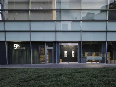a building with the entrance to a building at 9h nine hours Shinagawa station for men in Tokyo