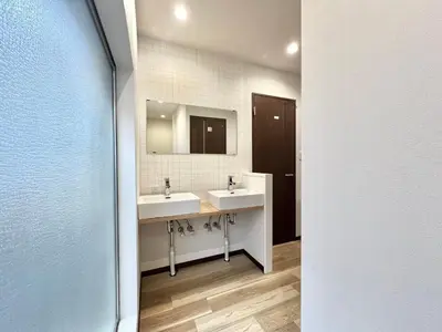 a bathroom with two sinks and a mirror at STS-Senzoku House-TT0187 in Tokyo