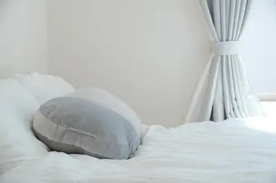 a pillow sitting on top of a bed at CON-TWO 201 in Tokyo