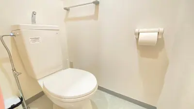 a bathroom with a toilet and a roll of toilet paper at CON-TWO 201 in Tokyo