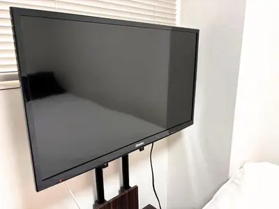 a flat screen tv hanging on a wall at FARE Akihabara - Stylish Studio 8min from Station 102 in Tokyo