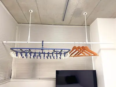 a room with a television and a rack of shoes at FARE Akihabara - Stylish Studio 8min from Station 102 in Tokyo