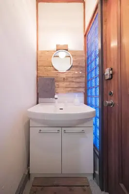 a bathroom with a white sink and a mirror at Push house \u6d66\u5b89 in Tokyo