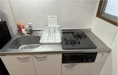 a kitchen counter with a sink and a stove at Tokyo Stay \u821e in Tokyo