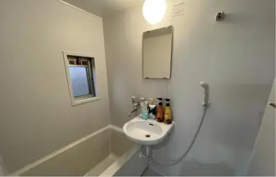 a white bathroom with a sink and a shower at Tokyo Stay \u821e in Tokyo