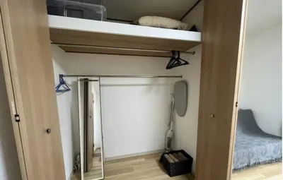 a room with a bunk bed and a mirror at Tokyo Stay \u821e in Tokyo