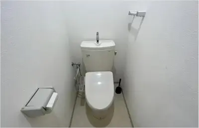 a bathroom with a white toilet in a white wall at Tokyo Stay \u821e in Tokyo