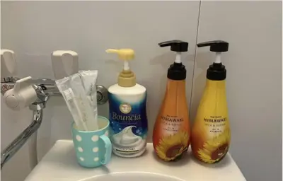 three bottles of cleaning products sitting on a sink at Tokyo Stay \u821e in Tokyo
