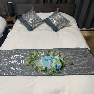 a bed with a flower arrangement on top of it at 54, Tateishi, Entire house for rent, \u7acb\u77f3 in Tokyo