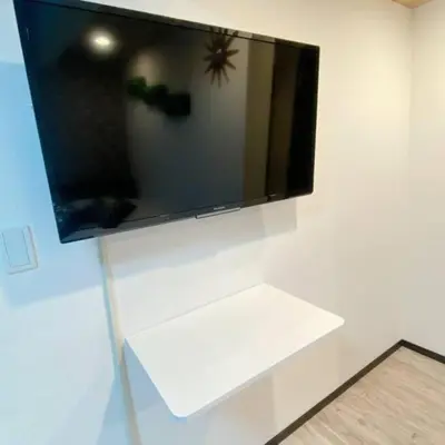a flat screen tv hanging on a wall at 54, Tateishi, Entire house for rent, \u7acb\u77f3 in Tokyo