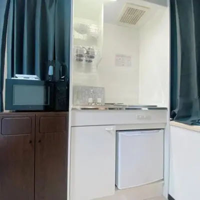 a kitchen with a sink and a microwave at 54, Tateishi, Entire house for rent, \u7acb\u77f3 in Tokyo