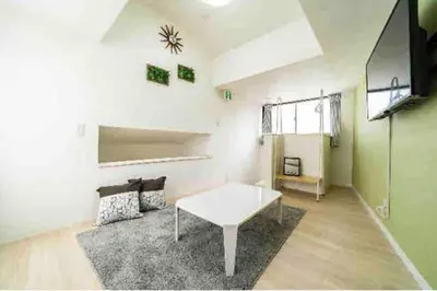 a living room with a white table and a couch at 55, Kameido-Suijin, Entire house for rent, \u4e80\u6238\u6c34\u795e in Tokyo
