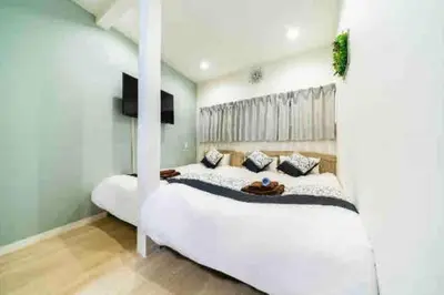 a bedroom with a large white bed in a room at 55, Kameido-Suijin, Entire house for rent, \u4e80\u6238\u6c34\u795e in Tokyo