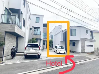 a car parked in a parking lot next to a building at L\uff06L\uff08Love\uff06Life\uff09 in Tokyo