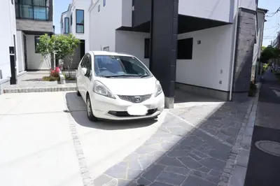 a white car parked in front of a building at L\uff06L\uff08Love\uff06Life\uff09 in Tokyo