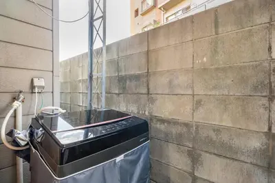 a trash can sitting next to a brick wall at Max12PPL!7m walk from station!Japan style house! in Tokyo