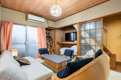 a living room with a couch and a table at Max12PPL!7m walk from station!Japan style house! in Tokyo