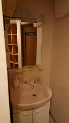 a bathroom with a sink and a mirror at Stage YOU in Tokyo