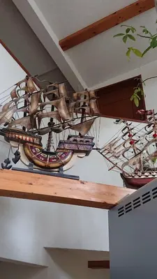 a large wooden boat hanging from a ceiling at Stage YOU in Tokyo