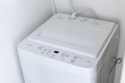 a white washer and dryer in a room at 67 Apt Koenji Tokyo in Tokyo