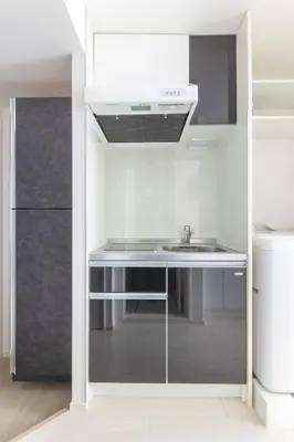 a kitchen with a sink and a refrigerator at APB\u9ad8\u5186\u5bfa in Tokyo