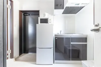 a white kitchen with a refrigerator and a sink at APB\u9ad8\u5186\u5bfa in Tokyo