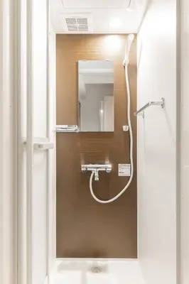 a bathroom with a shower with a mirror at APB\u9ad8\u5186\u5bfa in Tokyo