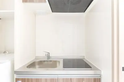 a kitchen with a sink in a white kitchen at APB\u9ad8\u5186\u5bfa in Tokyo