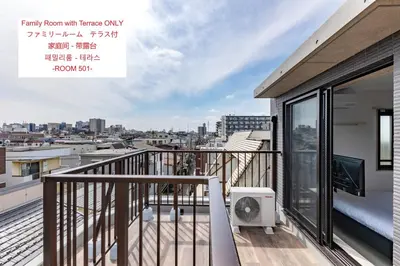 a balcony with a view of a city at APB\u9ad8\u5186\u5bfa in Tokyo