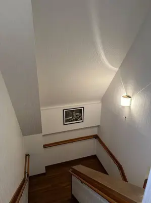 a room with a staircase with a light on the ceiling at Kyo Sai \u6d45\u83493F\u3000120\u33a1\u8d85\u3048\u6d45\u8349\u5bfa\u307e\u3067\u5f92\u6b65\u7d0410\u5206 in Tokyo