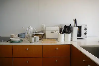 a kitchen counter with utensils and appliances on it at GRASS BLDG 501 in Tokyo