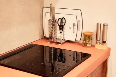 a kitchen counter with a stove top oven at anchorAsakusa Vacation Rental in Tokyo