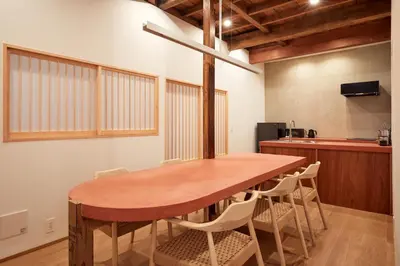 a dining room with a wooden table and chairs at anchorAsakusa Vacation Rental in Tokyo