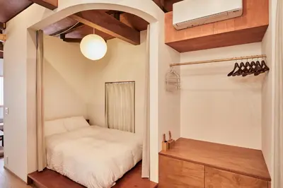 a small bedroom with a bed and a closet at anchorAsakusa Vacation Rental in Tokyo