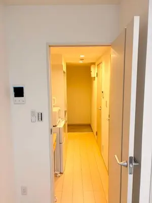an open door to a hallway in a room at IXO Ts3 in Tokyo