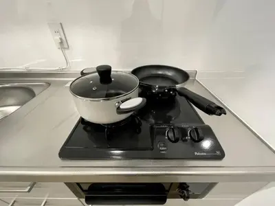 a pot on top of a stove in a kitchen at Nishi-Ike Apartment Room 1 in Tokyo