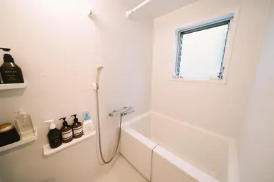 a white bathroom with a shower and a tub at 50m 2DK Private Condo!Center of Tokyo!5min Akasaka sta!! in Tokyo
